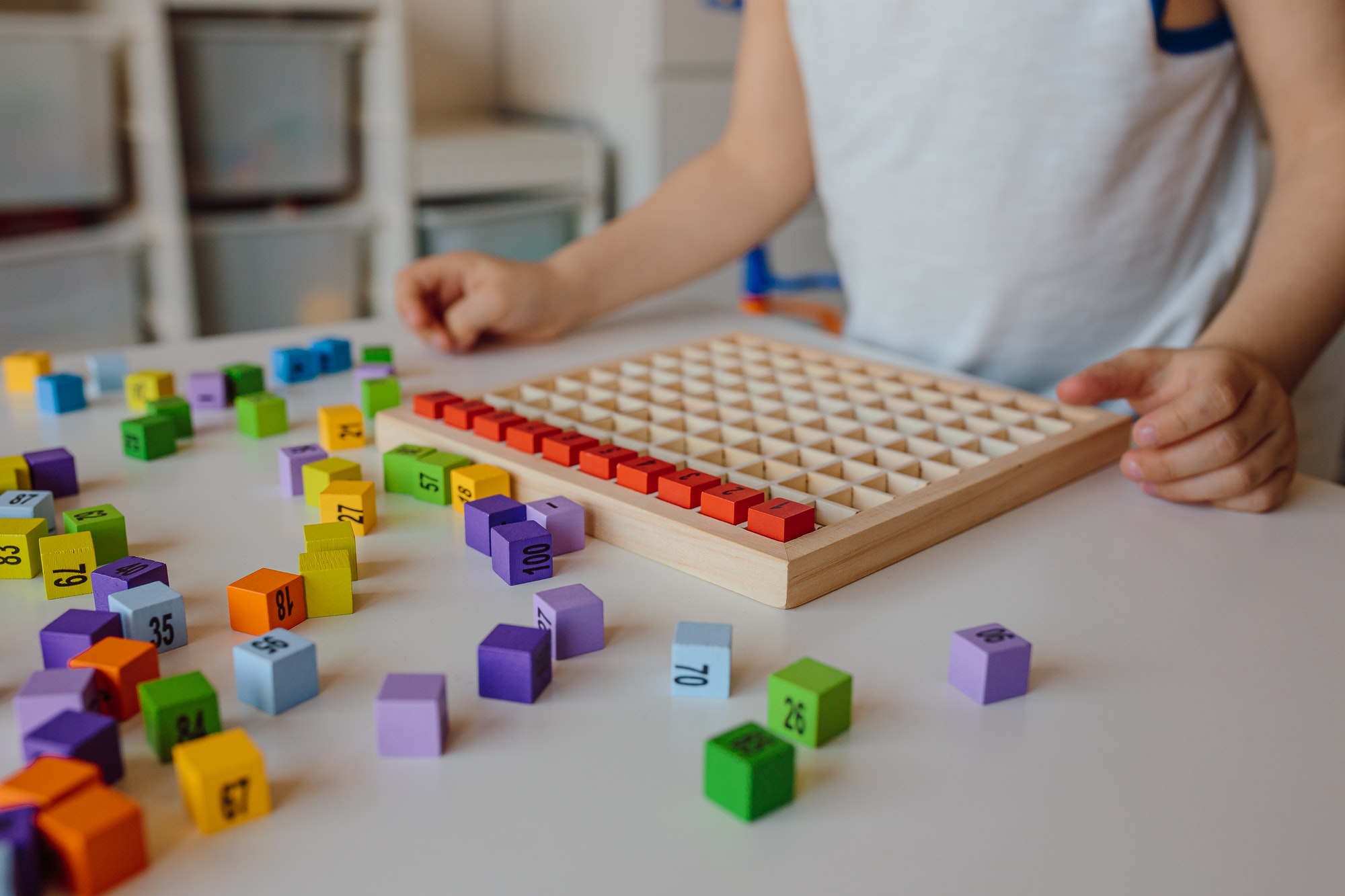 Autism, child with special needs, little boy is passionate about signs symbols, numbers and letters.